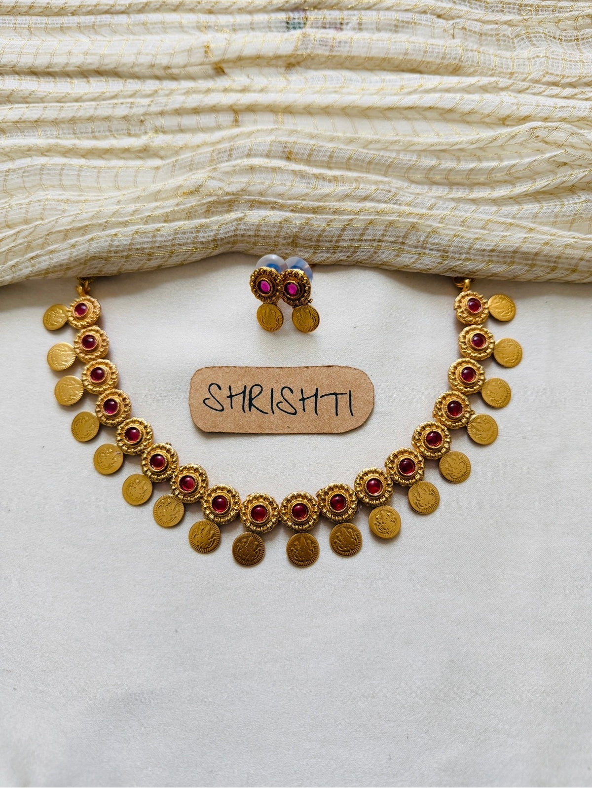 Ruby gold coin